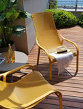 Nardi Mustard Net Lounge chairs & Taupe coffee table on a balcony